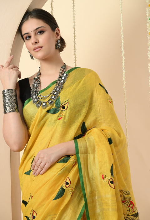 Contrast blouse fabric with green piping paired with yellow linen embroidered saree