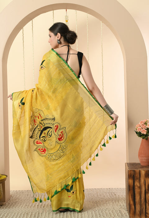Festive handwoven linen saree in yellow with Maa Durga embroidery, perfect for puja and office gatherings