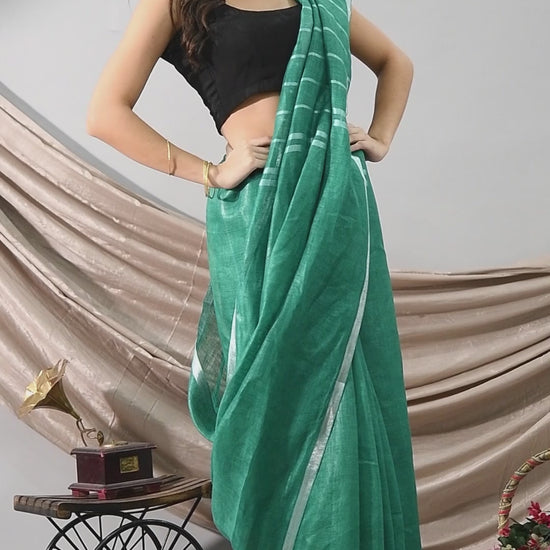 Swapna Creation Green Handwoven Linen Saree with silver handspun zari border and stripes on Pallu
